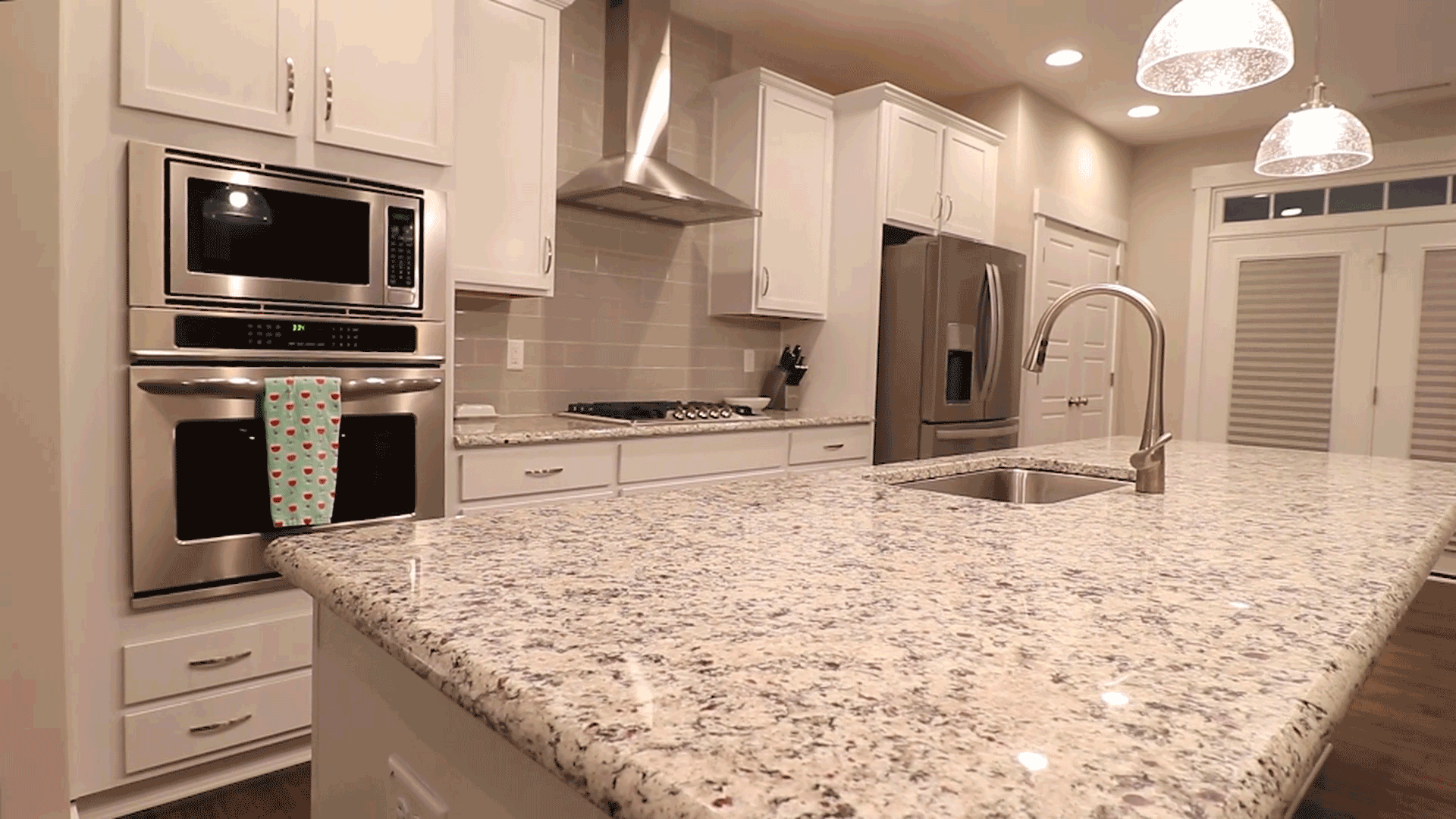 kitchen with granite and white cabinetry